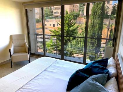 Sleek & Cozy Apartment with Pool & Patio In Abdoun - image 23